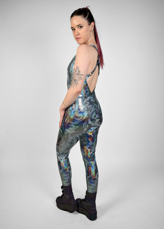 Womens music fesival fashion - Festival-outfit-rave-outfit - handmade-in-Brooklyn-New York City-custom made-waste conscious– retro style – hippie fashion –rave bralette top – festival jumpsuit - sleevless– retro style – supportive x back – adjustable straps - silver sparkly print - side view - on model